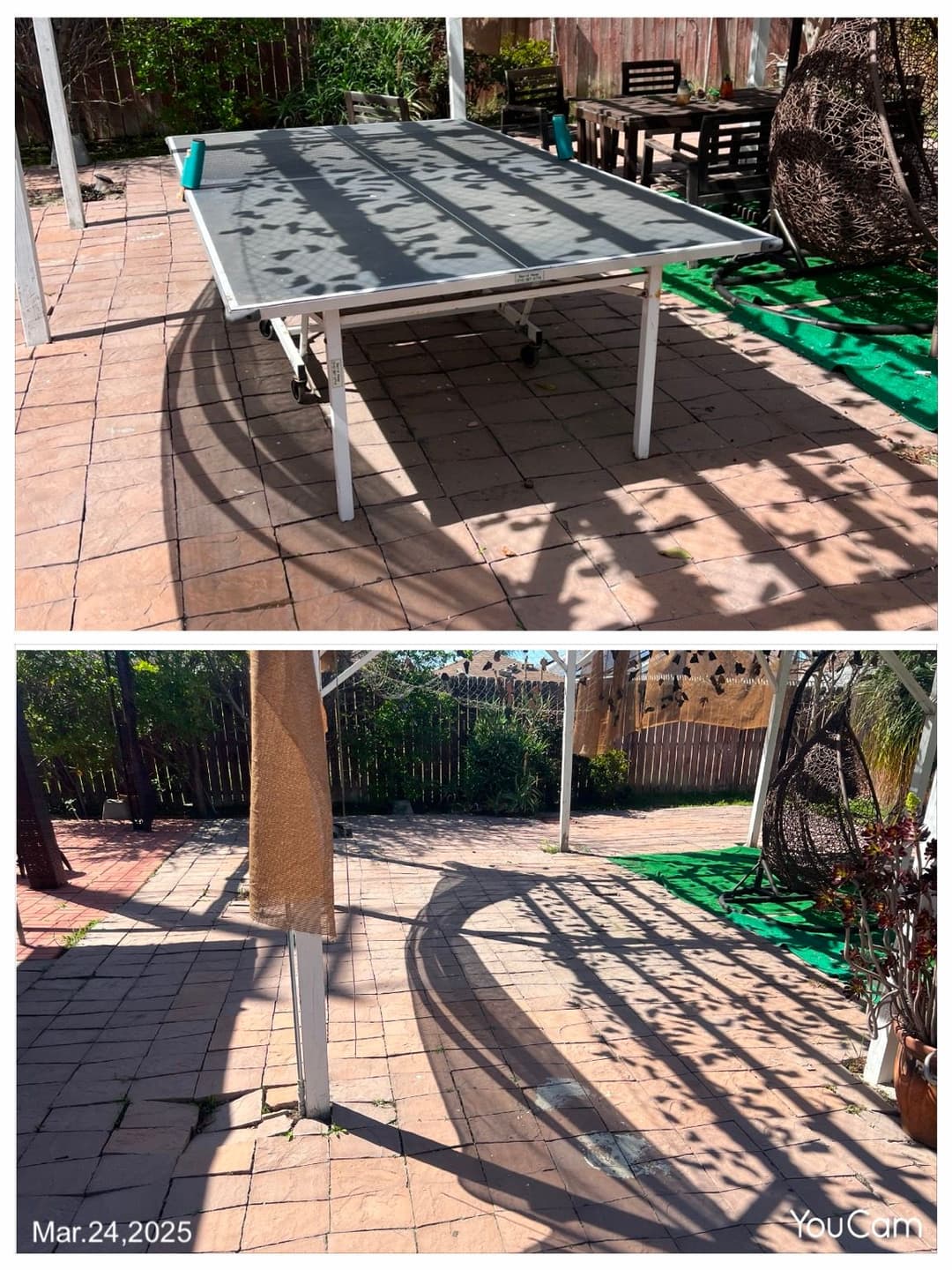 Outdoor patio with a gray table casting shadows on the tiled floor, garden setting.
