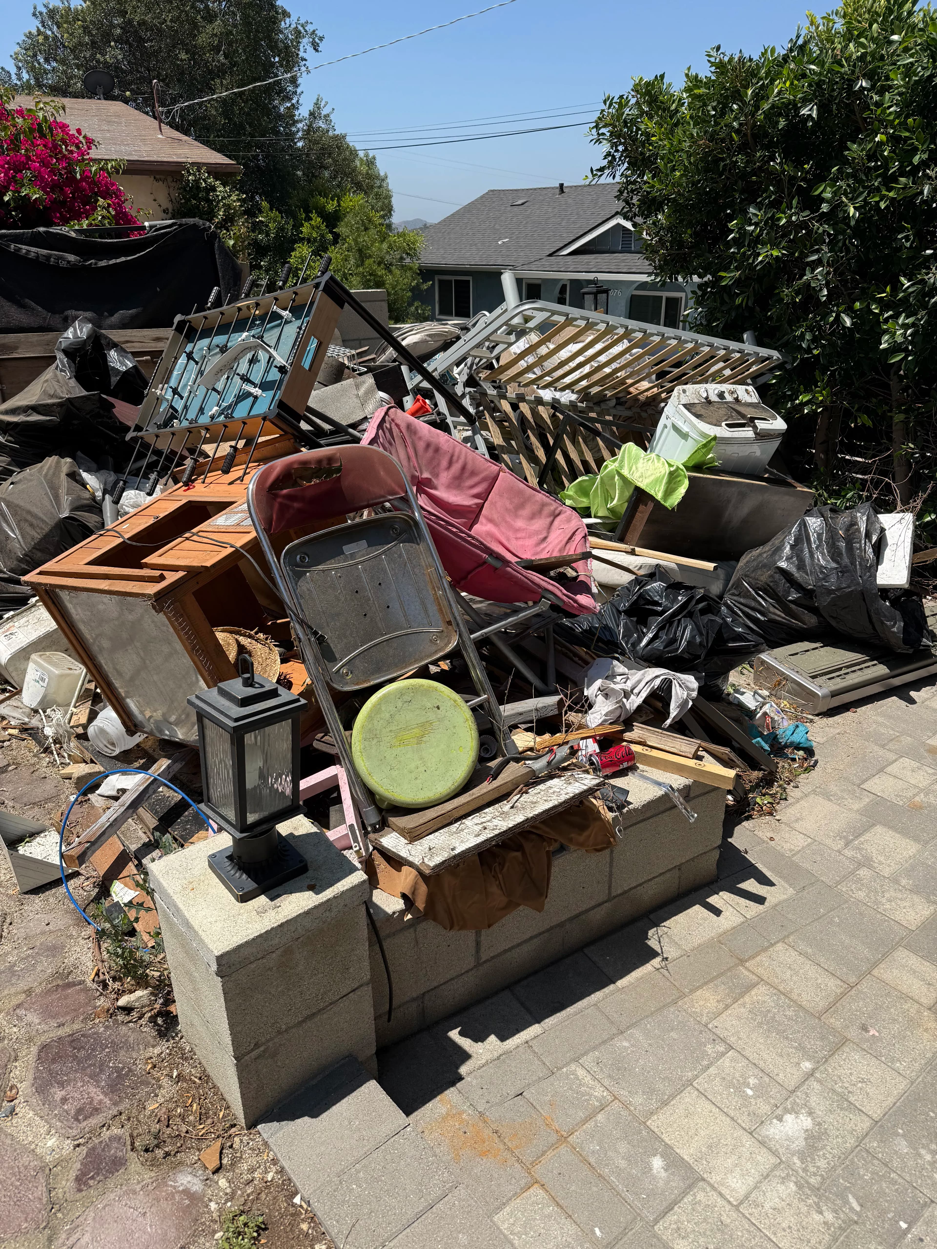 Project Massive Junk Pile Cleared From a Residential Outdoor Space image