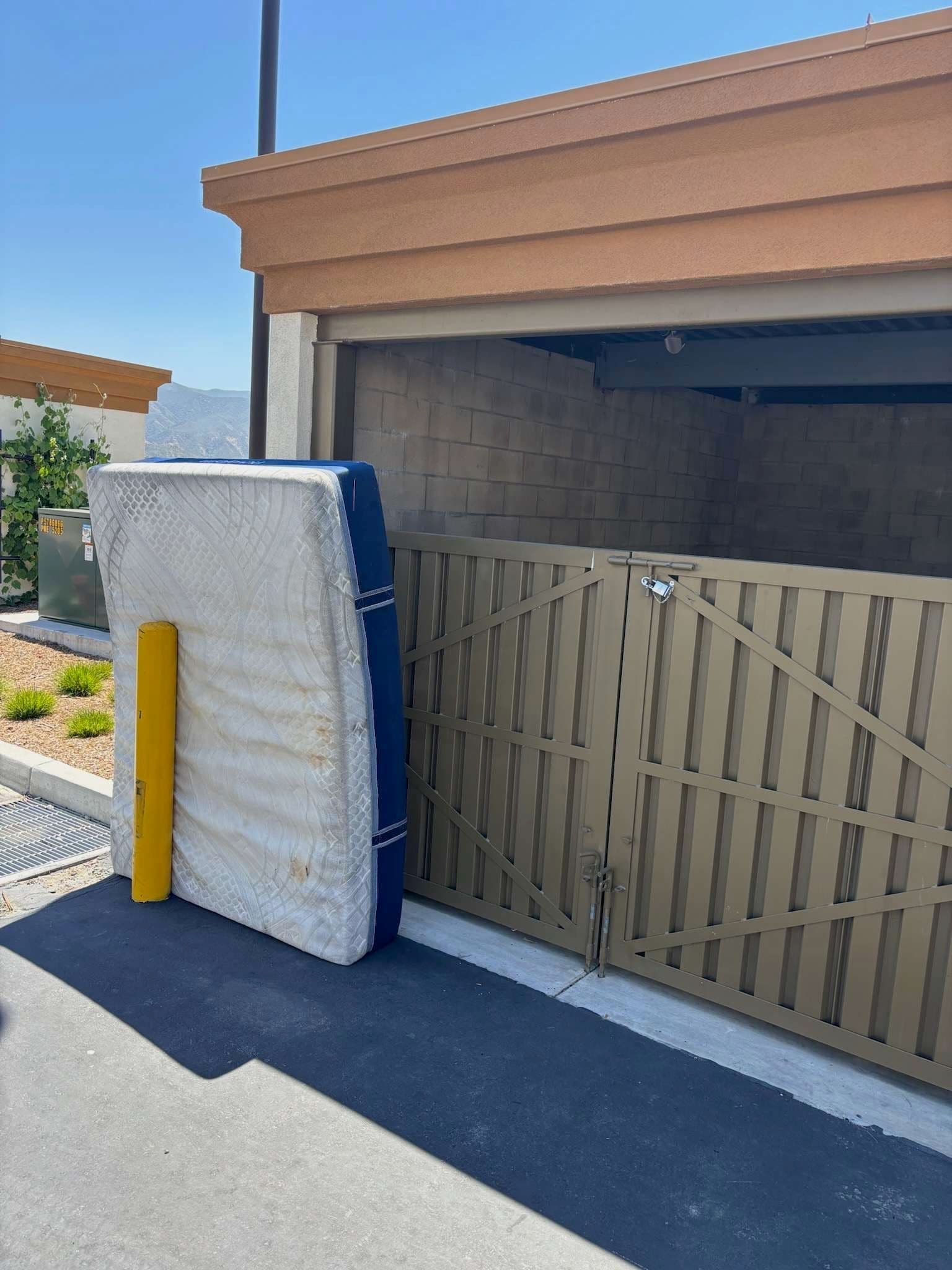 Old Mattress and Junk Cleared Out of a Commercial Property image